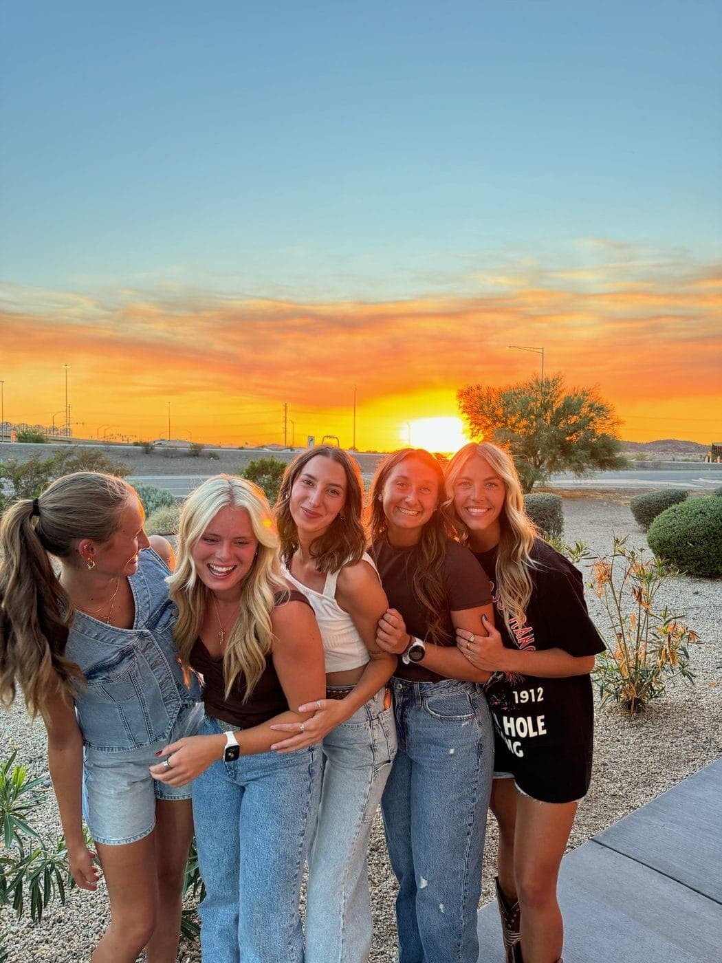 A group of friends on a girls trip at sunset