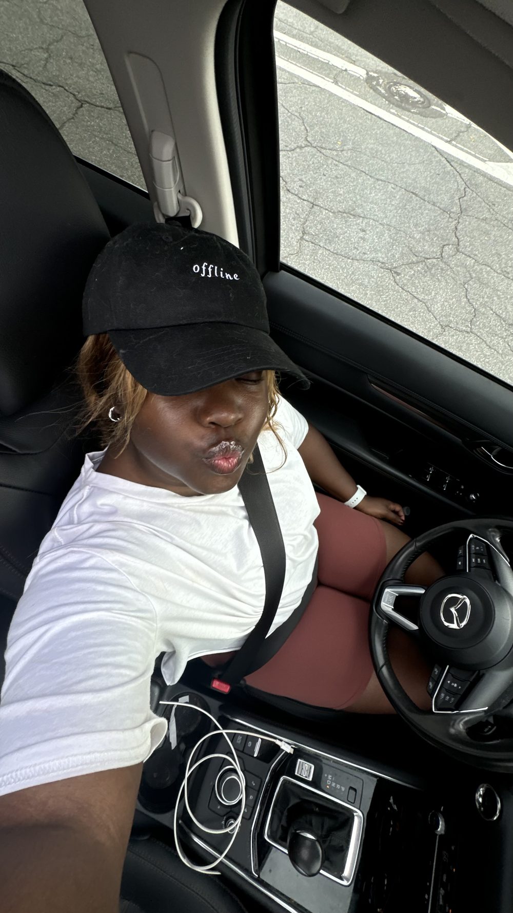 The trip organizer in her car, finally offline and on the way
